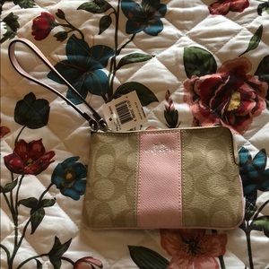 Pink and khaki coach wristlet